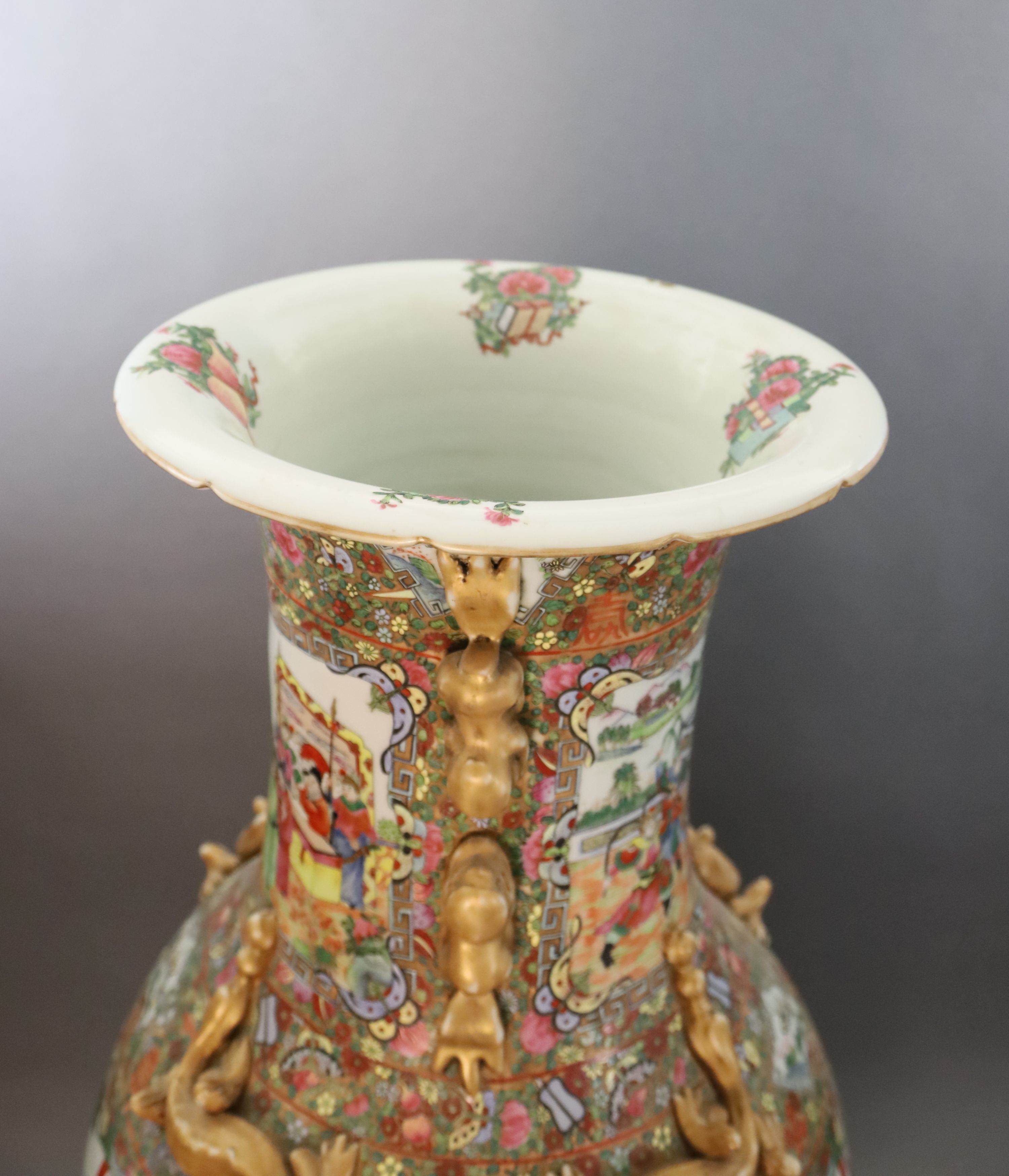 A pair of massive Chinese Canton style famille rose vases, 20th century and a pair of Chinese hongmu and marble stands, late 19th century